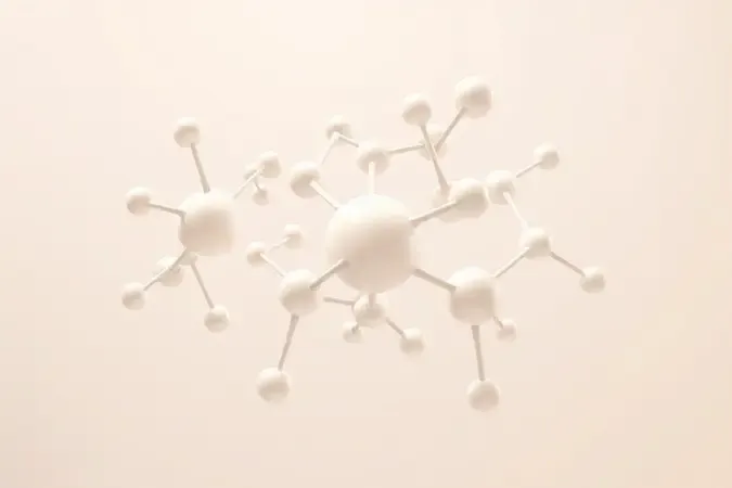 Representação conceitual 3D de estruturas moleculares com esferas elegantes em tons pastel e perolados simbolizando química capilar.