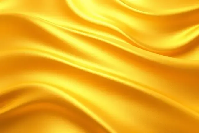 Superfície com gradiente dourado uniforme representando aplicação homogênea de bronzeador sem manchas